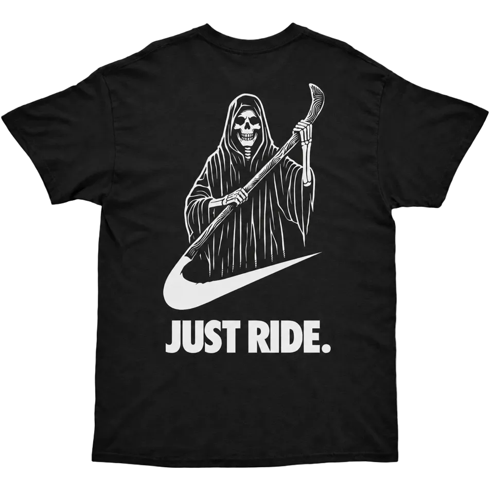 Black t-shirt with a graphic of a skeleton holding a scythe and 'Just Ride' text on a light gray background.